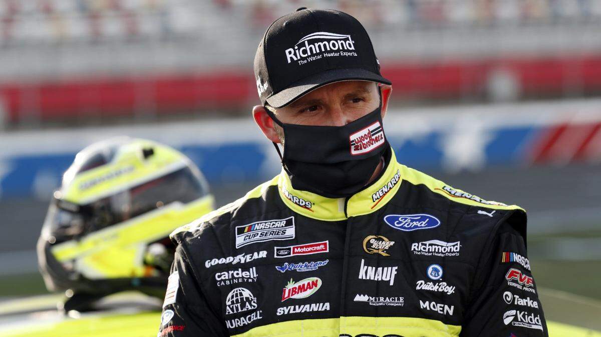 NASCAR Matt DiBenedetto wears a mask ahead of the Cup Series race at Charlotte Motor Speedway in 2020. NASCAR is now requiring face masks be worn inside enclosed areas of race tracks.