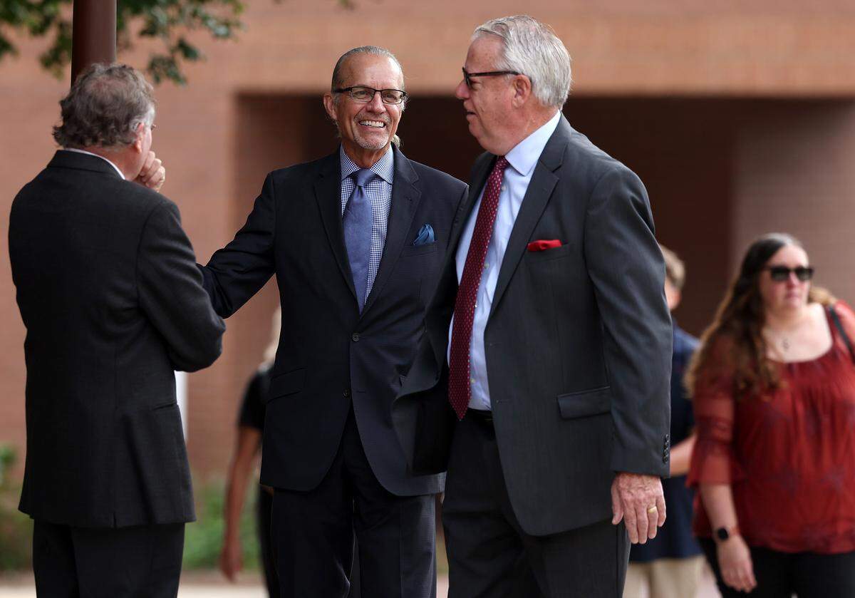 Former NASCAR driver Kyle Petty, center, talks with other attendees at the funeral for former longtime Charlotte Motor Speedway president H.A. “Humpy” Wheeler, Jr., on Tuesday, August 26, 2025 at St. Gabriel Catholic Church in Charlotte. 