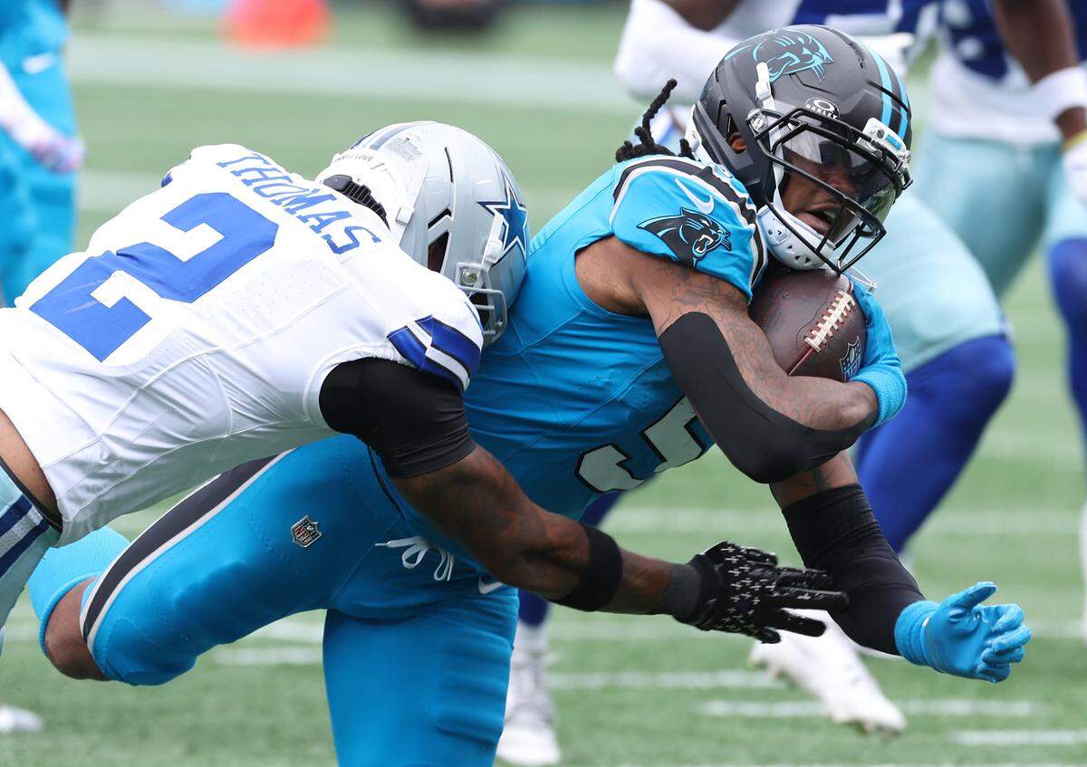 Carolina Panthers running back Rico Dowdle fights for yardage during action against the Dallas Cowboys on Sunday, October 12, 2025, at Bank of America Stadium.