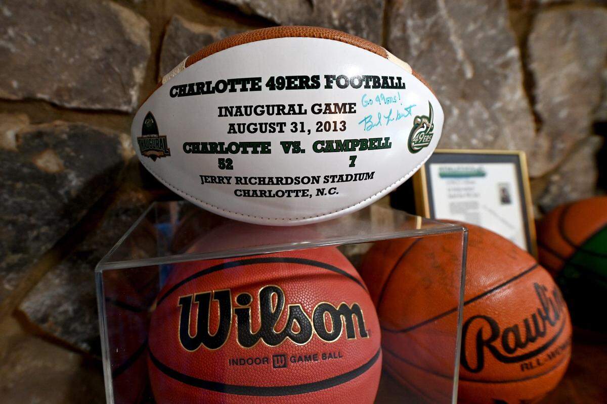 An inaugural football from the Charlotte 49ers’ first-ever game against Campbell, in 2013, is among former director of athletics Judy Rose’s prized possessions. Rose was instrumental in the addition of college football to the school’s athletic program.