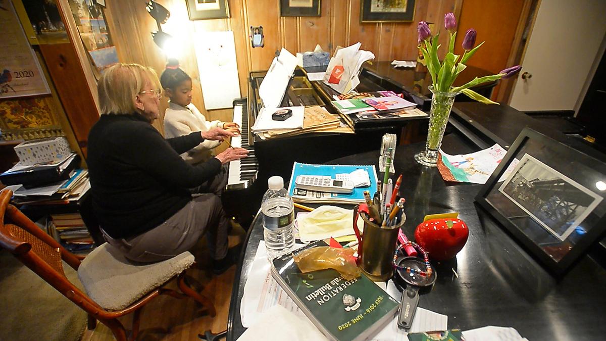 Dzidra Reimanis, a 92-year-old piano teachers, conducts a lesson with Kendall McKnight, 6, in Reimanis’ home on Thursday, February 6, 2020. Reimanis has been teaching piano in Charlotte for more than 50 years