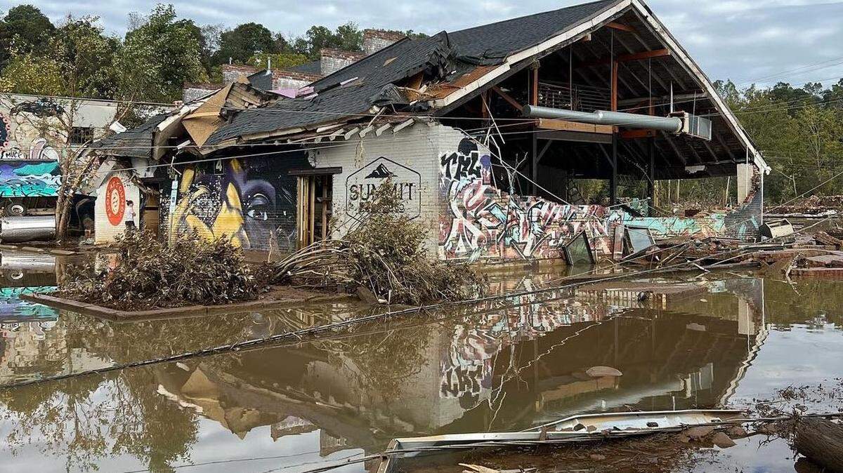 When the French Broad River flooded Asheville’s River Arts District, it left destruction in its wake. Summit Coffee Co.’s damage is extensive: Its main wall is nearly gone, its roof partially caved in and a mixture of mud and debris lies inside.