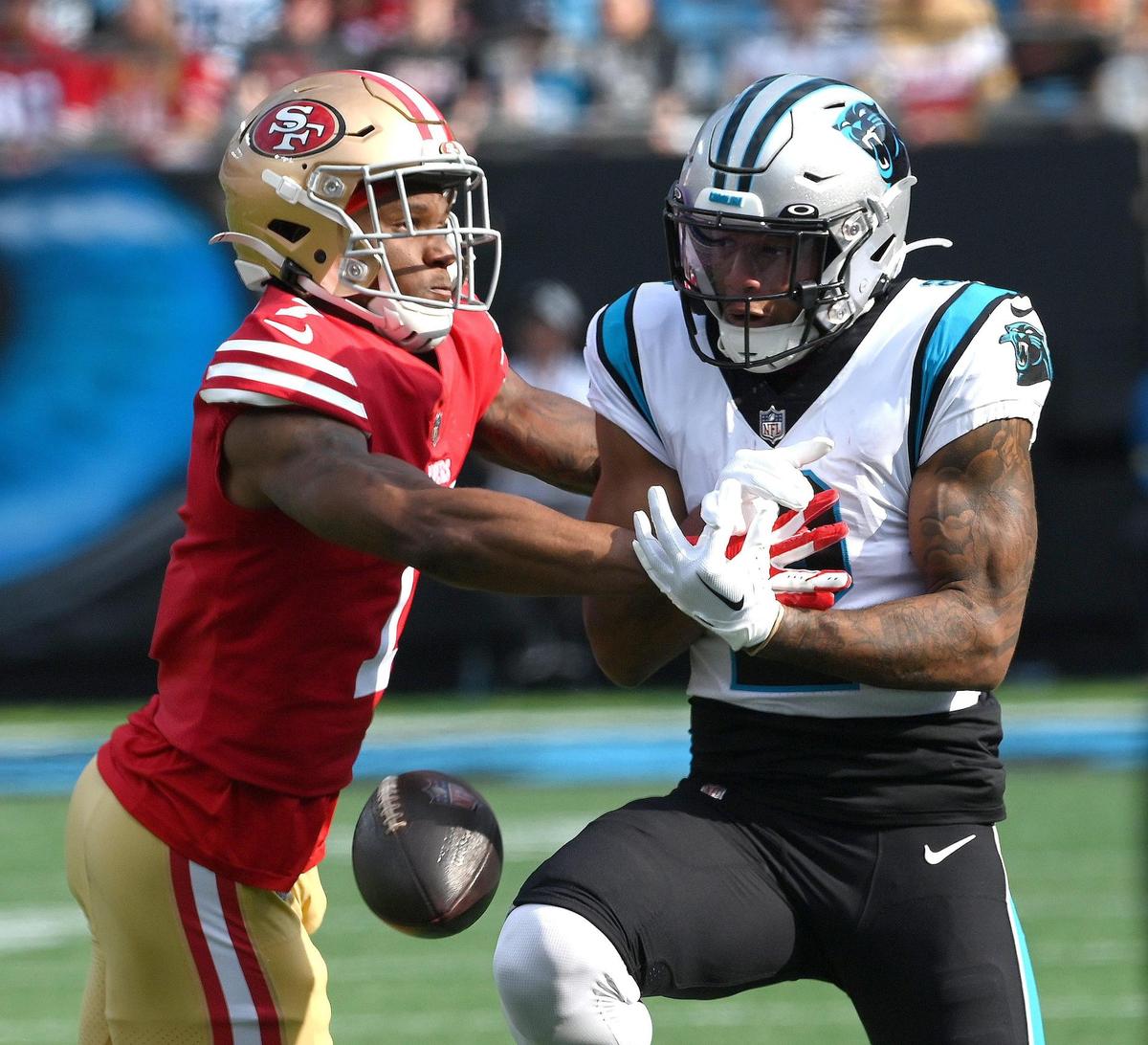Carolina Panthers wide receiver DJ Moore, right, is unable to catch a pass as San Francisco 49ers cornerback Charvarius Ward, left, applies defensive pressure during first quarter action at Bank of America Stadium on Sunday, October 9, 2022.