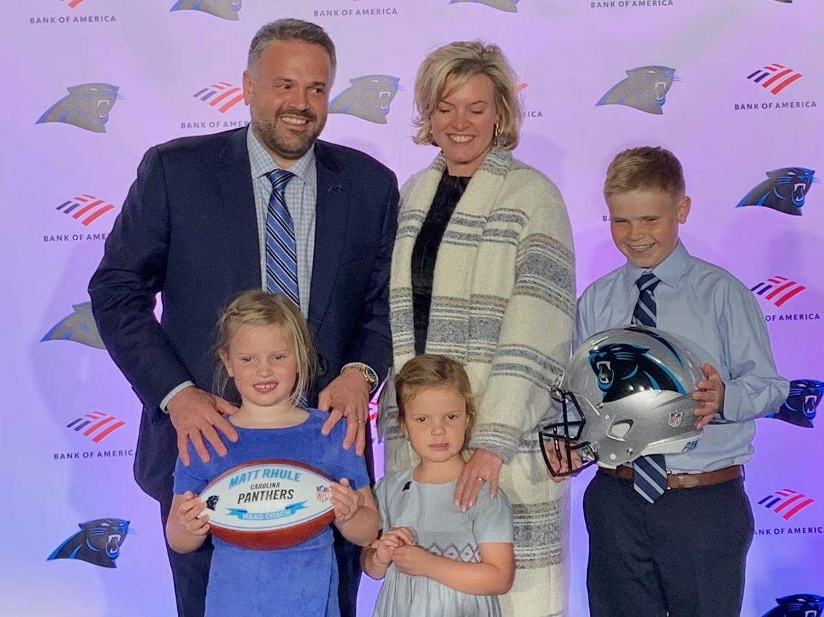 Matt Rhule and his wife, Julie, at his introductory press conference as Panthers head coach. His children (left to right) Vivienne, Leona and Bryant.