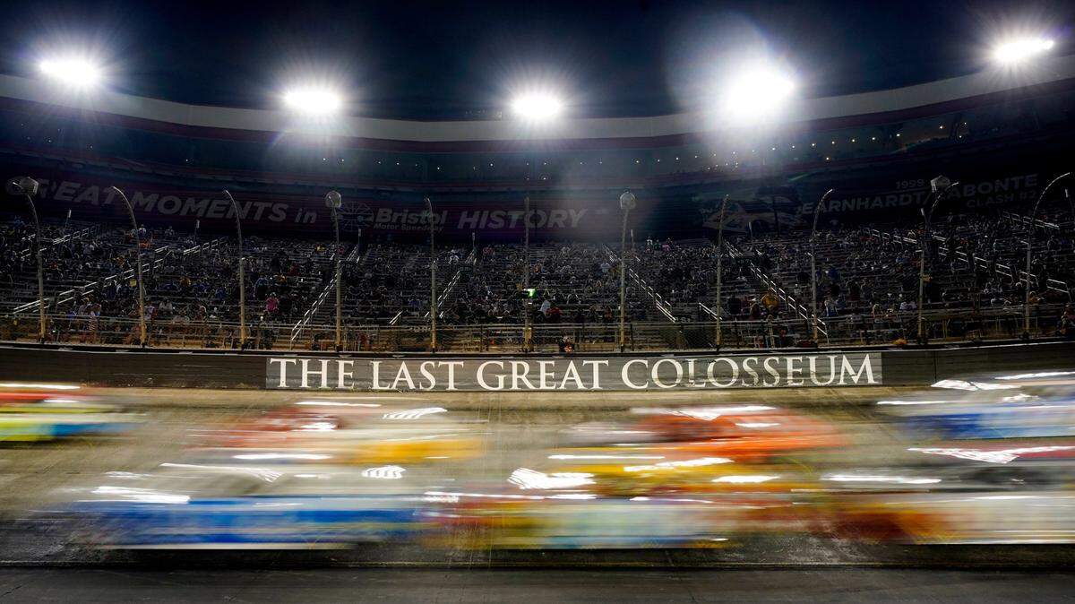 Cars come through a turn during a NASCAR Cup Series auto race at Bristol Motor Speedway Saturday, Sept. 18, 2021, in Bristol, Tenn. (AP Photo/Mark Humphrey)