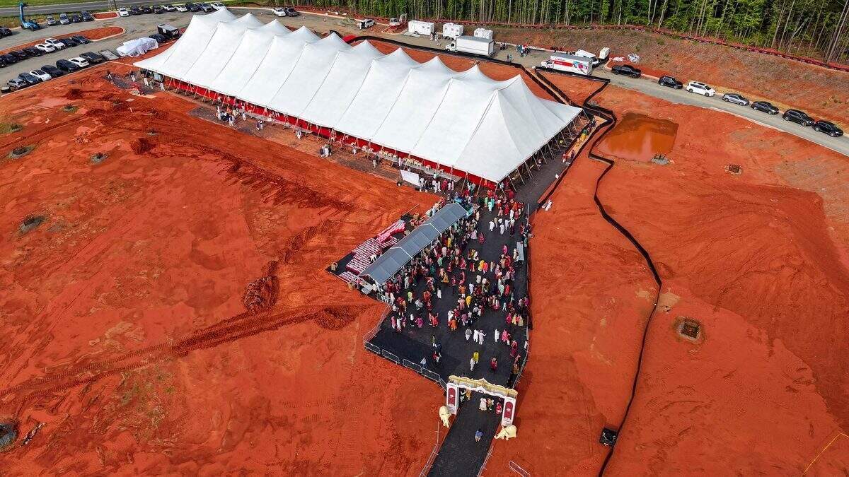 BAPS community members gathered on the land where the 72,000-square-foot mandir will be built.
