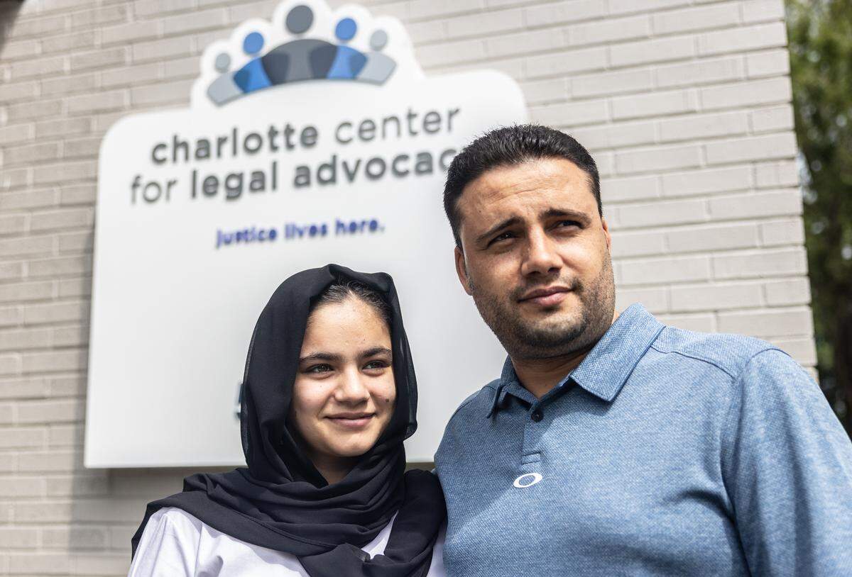 Tahira Askari, left, poses for a portrait with her uncle, Bahroz Mohmand, at Charlotte Center for Legal Advocacy in Charlotte, N.C., on Monday, August 22, 2022.