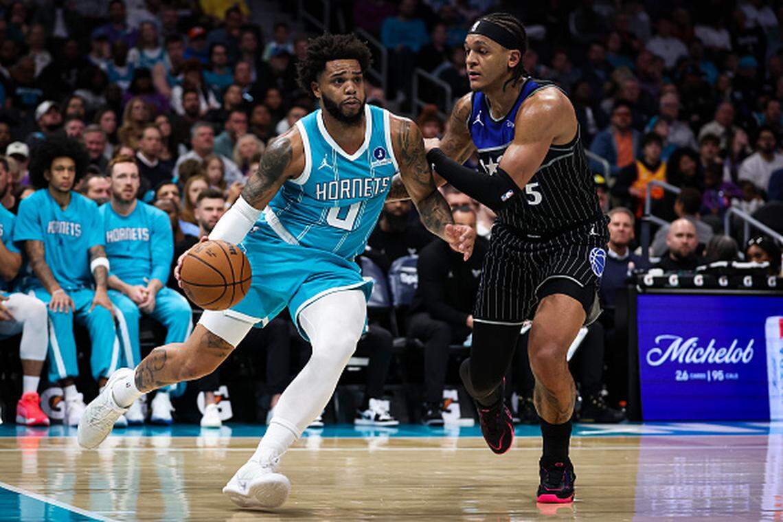 Miles Bridges of the Charlotte Hornets dribbles the ball past by Paolo Banchero of the Orlando Magic during their mid-March game in Charlotte. 