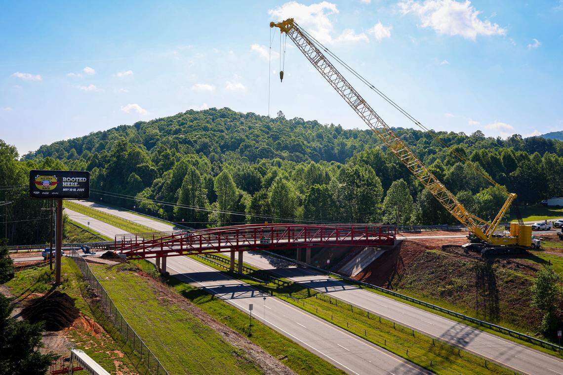 The new 200-foot Pedestrian Bridge over U.S. Highway 421 constructed by NCDOT and Smith-Rowe LLC is set to improve traffic flow for All-Star Race Week.