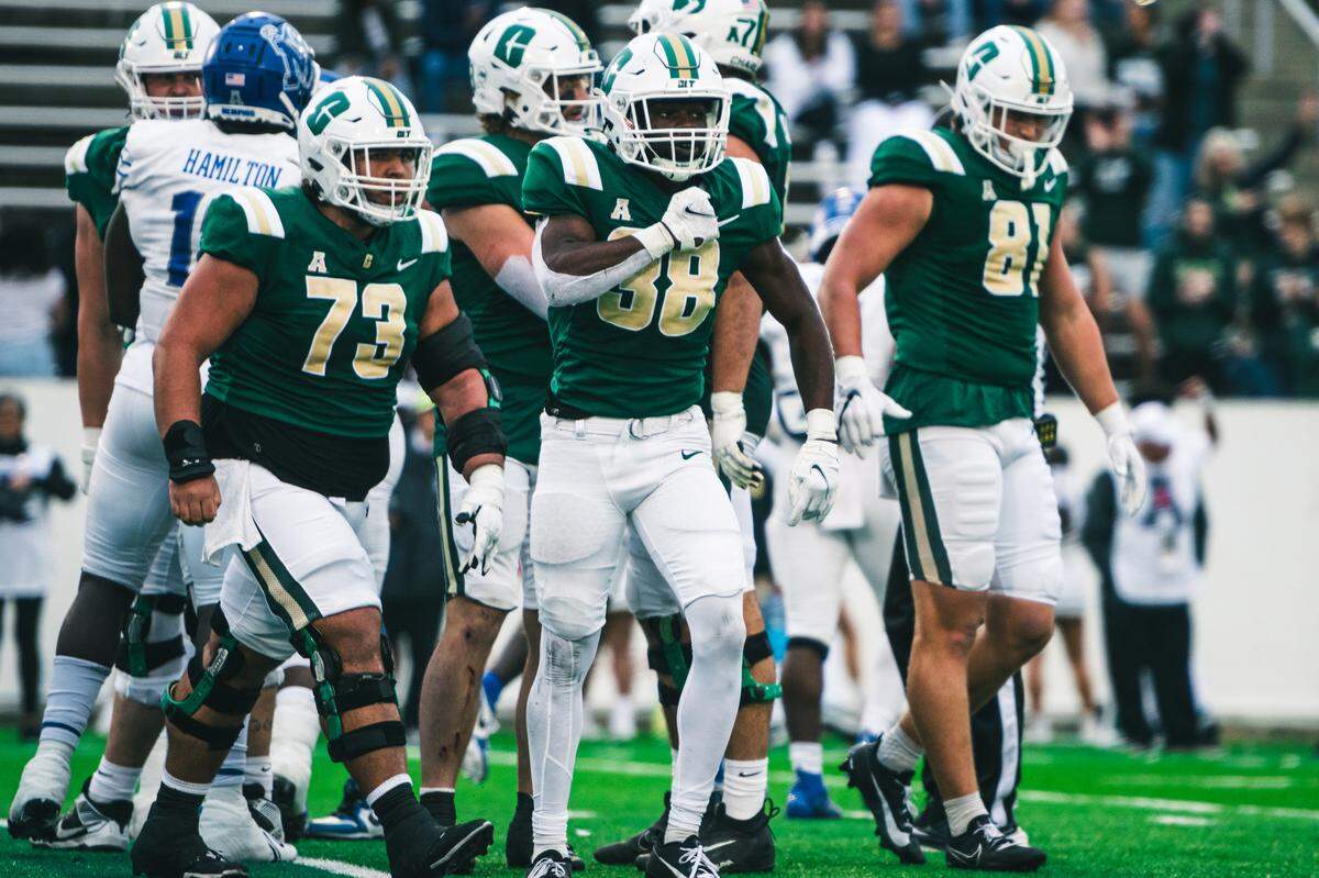 Hahsaun Wilson, middle, celebrates during his record performance in the Charlotte 49ers’ overtime battle against Memphis.