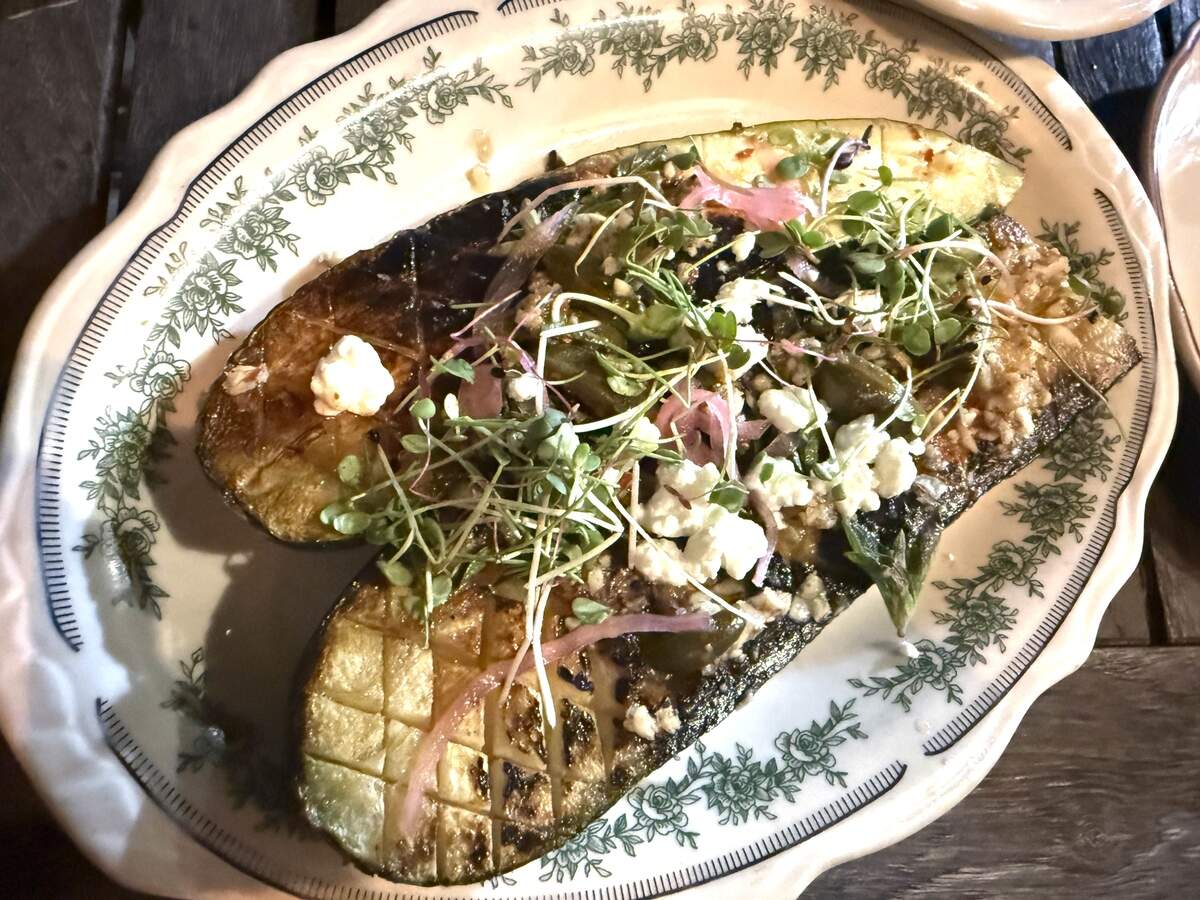 Haberdish’s charred zucchini dish include garlic, oregano, caper berries, whipped goat cheese, pickled red onion and micro greens.