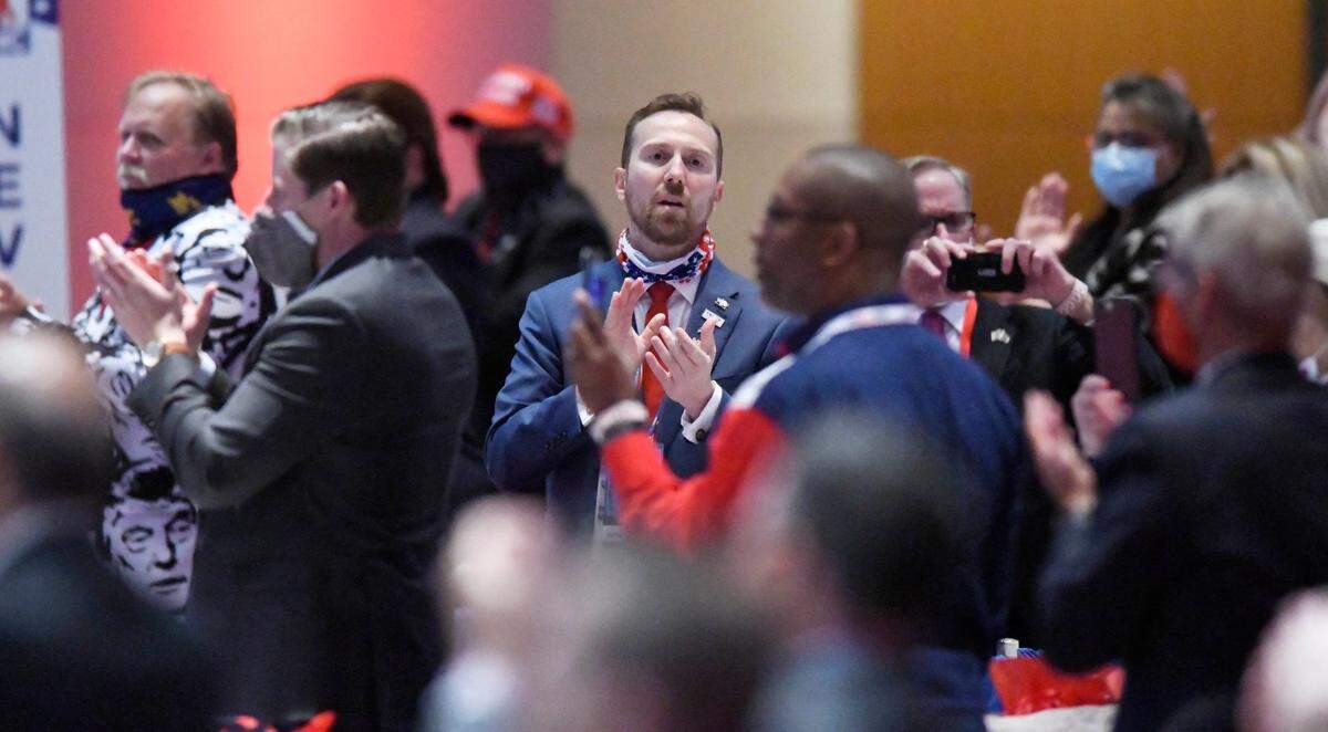 Republican National Convention delegates applaud while at the Charlotte Convention Center in Charlotte, N.C., Monday August, 24, 2020. The GOP convention was scaled back this year because of the coronavirus pandemic.