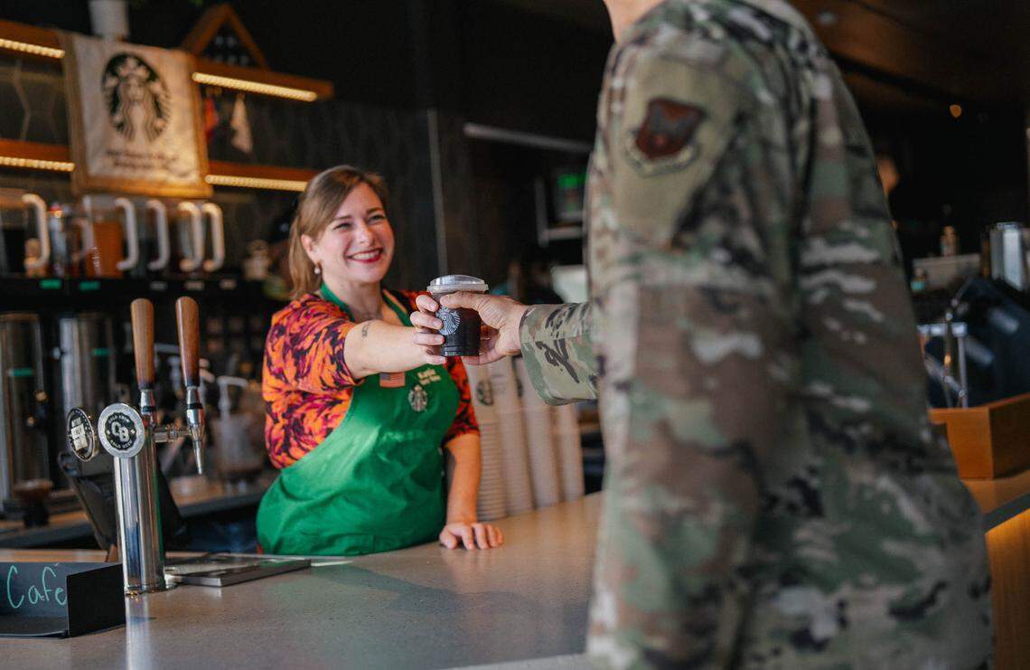 Members of Blue Star Families gather at the Starbucks Military Family Store near Joint Base Andrews in Brandywine, Maryland. Starbucks has recently added nearly 100 on-base coffee shops.