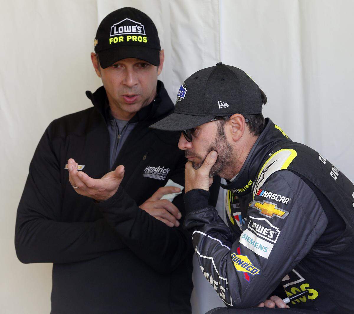 Jimmie Johnson, right, won’t have long-time crew chief Chad Knaus, left, to lean on this season.