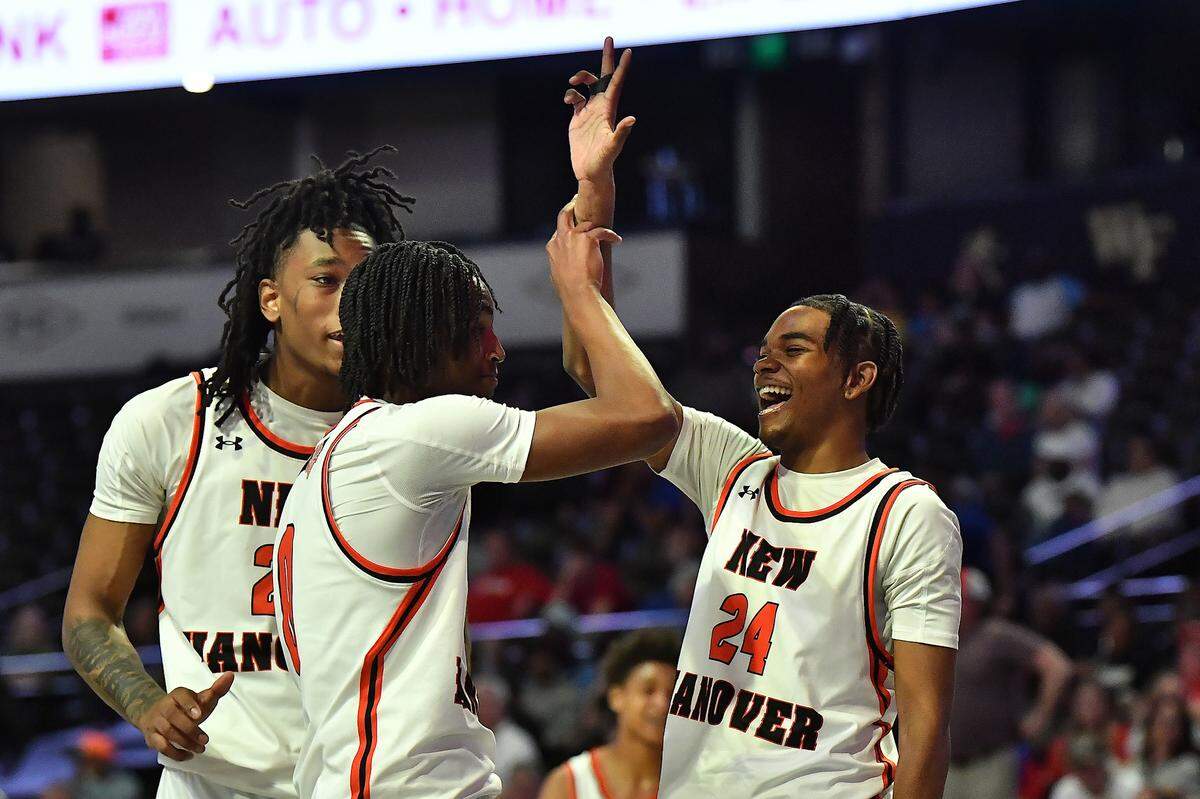 New Hanover’s Jakim Beatty (24) celebrates with teammates at the end of the first half against Sanderson in the NCHSAA 4a Boys East Regional Final. The Sanderson Spartans and the New Hanover Wildcats met in the NCHSAA 4A East Regional Final in Winston-Salem, N.C. on March 12, 2025.