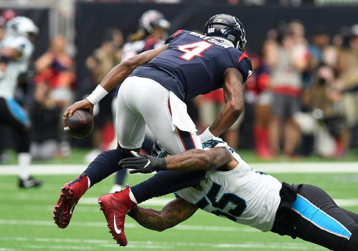 Carolina defensive end Bruce Irvin (55) drags down Houston quarterback Deshaun Watson for one of the Panthers’ six sacks in a 16-10 win Sunday.