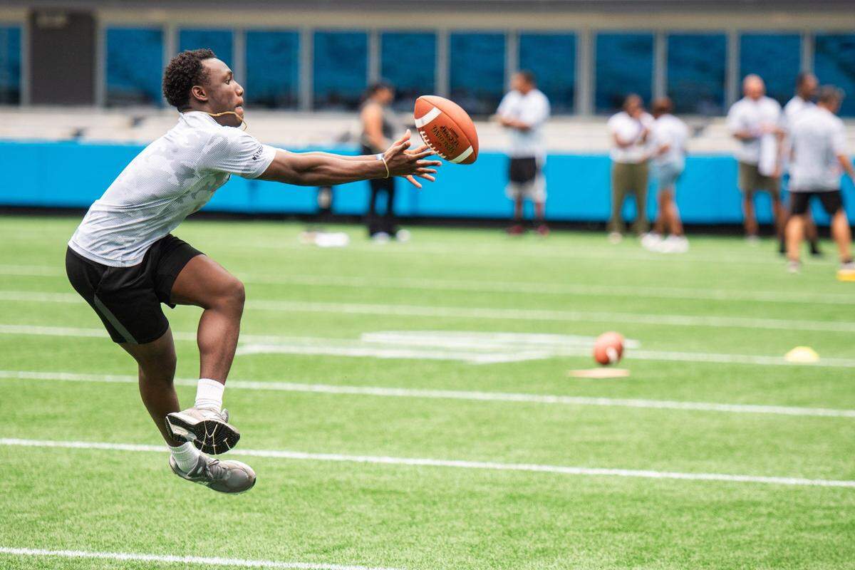 Nyle Erving, an Air Force soldier, participates in the wide receiver drill at the “USAA’s Salute to Service NFL Boot Camp” in the Bank of America Stadium on July 25, 2024. 100 of U.S. Service members trained like the Carolina Panthers for a day at the Panthers’ stadium. They participated in drills such as the 40-yard dash, broad jump, three-cone shuttle, receiving gauntlet, and the QB arm challenge. This is the first time the boot camp has been hosted on the Panthers’ field.