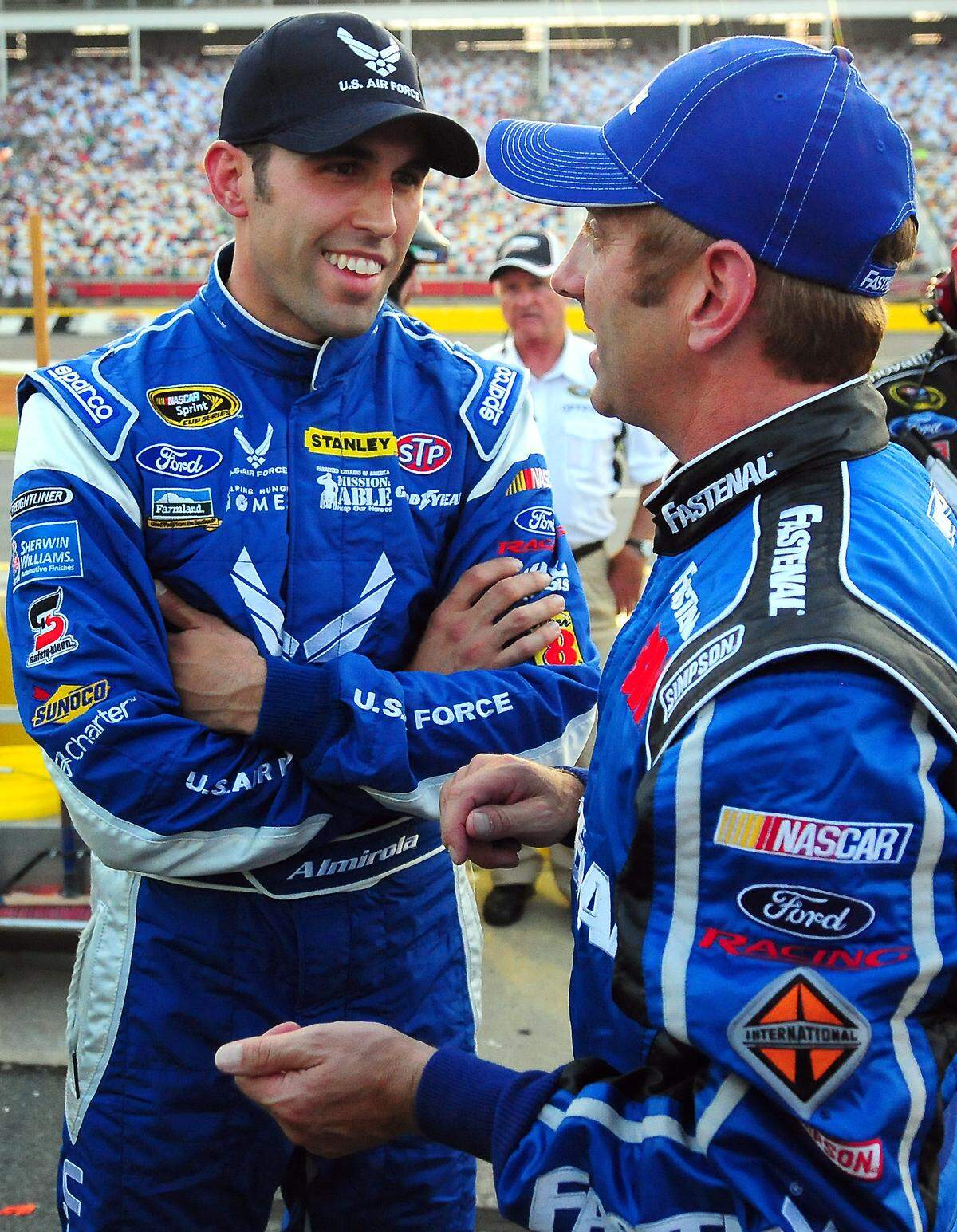 (L-R) NASCAR Sprint Cup Series drivers Aric Almirola and Greg Biffle talk along pit road following their qualifying runs for the Coca-Cola 600. Almirola won the pole for the Coca-Cola 600 with a time of 27.988 with a speed of 192.940 on Thursday, May 24, 2012 at Charlotte Motor Speedway in Concord, NC. The Coca-Cola 600 will be run on Sunday, May 27, 2012. Biffle finished in the fourth position with a time of 28.234 and a speed of 191.259.  