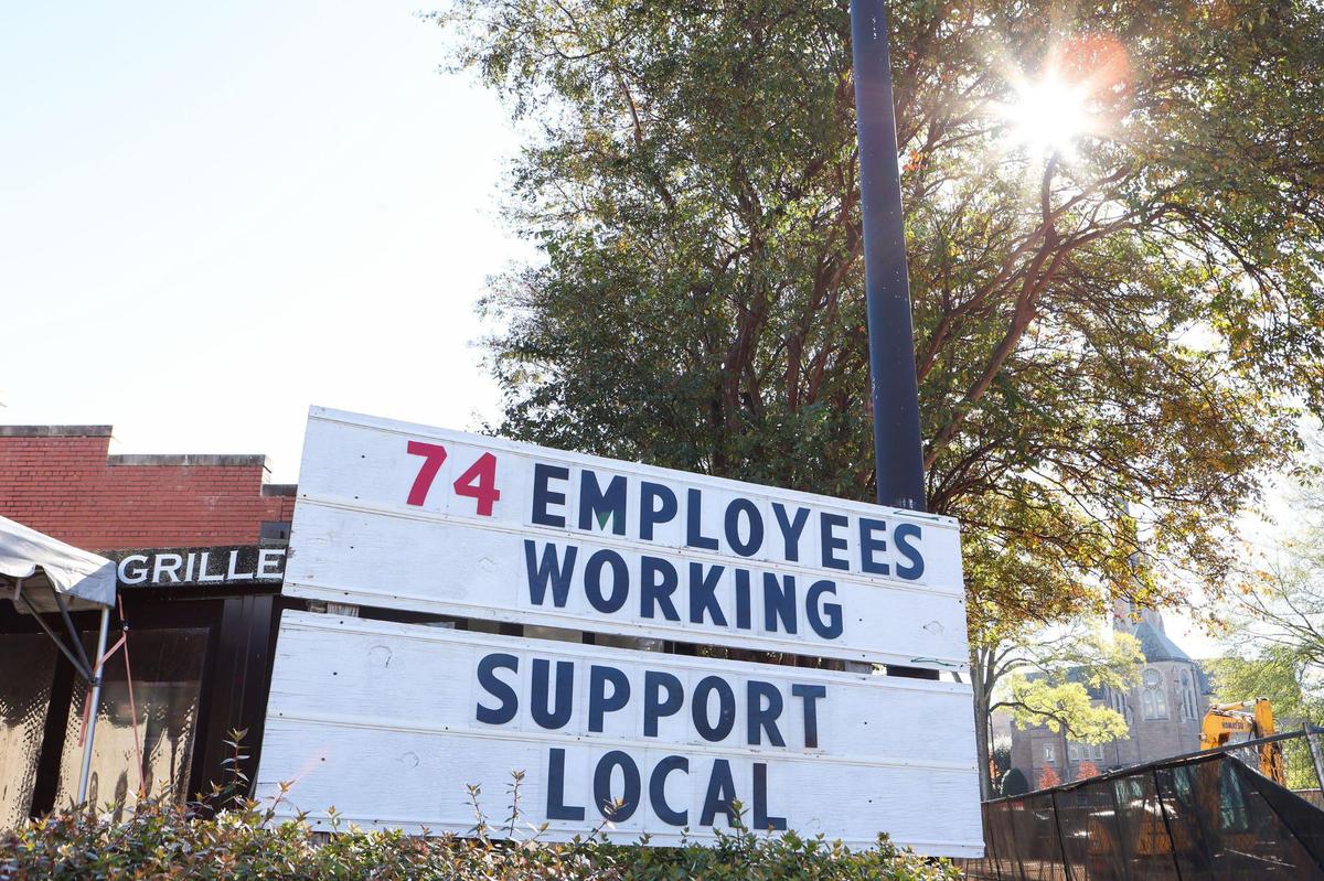A sign outside Dilworth Neighborhood Grille. A local commercial real estate firm filed a rezoning petition on the site of the longtime restaurant.