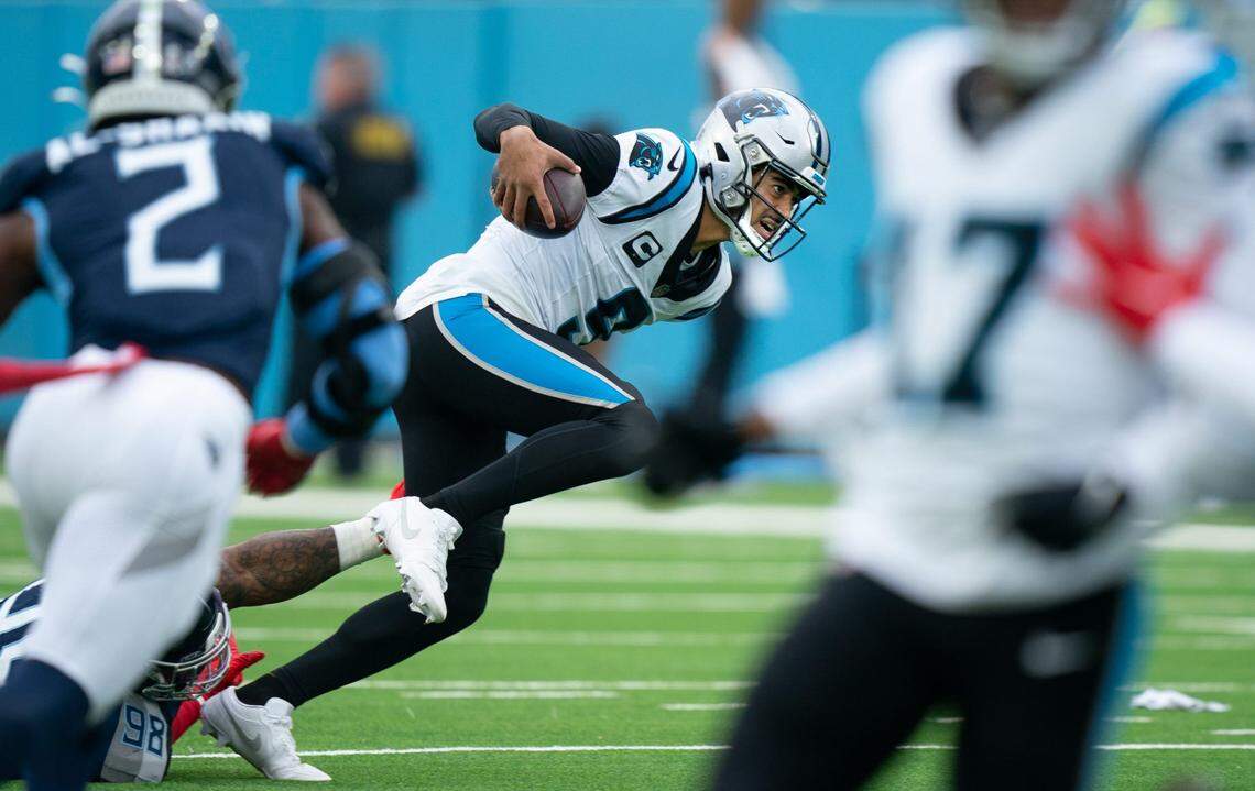Tennessee Titans defensive tackle Jeffery Simmons (98) narrowly misses stopping Carolina Panthers quarterback Bryce Young (9) on a third down play in the second quarter of their game at Nissan Stadium in Nashville, Tenn., Sunday, Nov. 26, 2023.