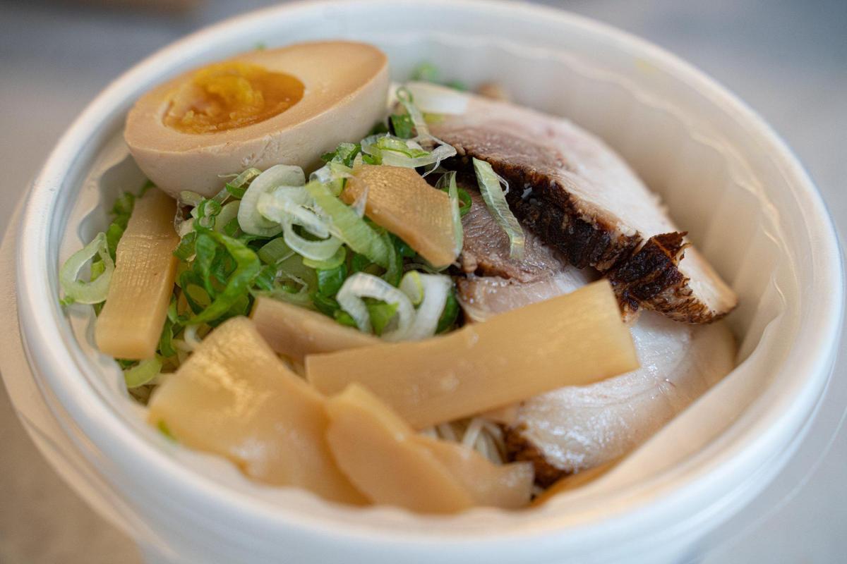 The Shirozaru at Saru by Bow Ramen at Camp North End is a classic pork broth, pork charshu, scallion, bamboo shoots, egg, sesame seeds and a spicy sauce.