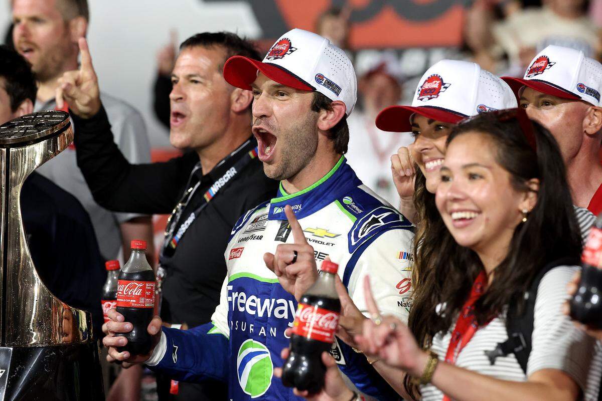 NASCAR driver Daniel Suarez after members of his team celebrate winning the Coca-Cola 600 at Charlotte Motor Speedway in Concord, NC on Sunday, May 24, 2026. Suarez was declared the winner when the race was stopped due to rain.