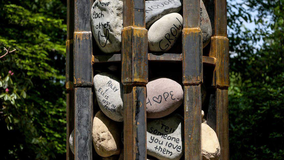 UNC Charlotte Botanical Gardens invited students, faculty, staff and visitors to record their thoughts and feelings by writing or drawing on small rocks, creating a temporary, ephemeral art installation. These stones were integrated into a permanent, monumental sculpture by Botanical Gardens staff and the Department of Art and Architecture to commemorate the community’s solidarity and fellowship in the face of tragedy. The memorial is located in the Asian Garden area of the Botanical Gardens seen here on Friday, April 22, 2022 in Charlotte, NC.