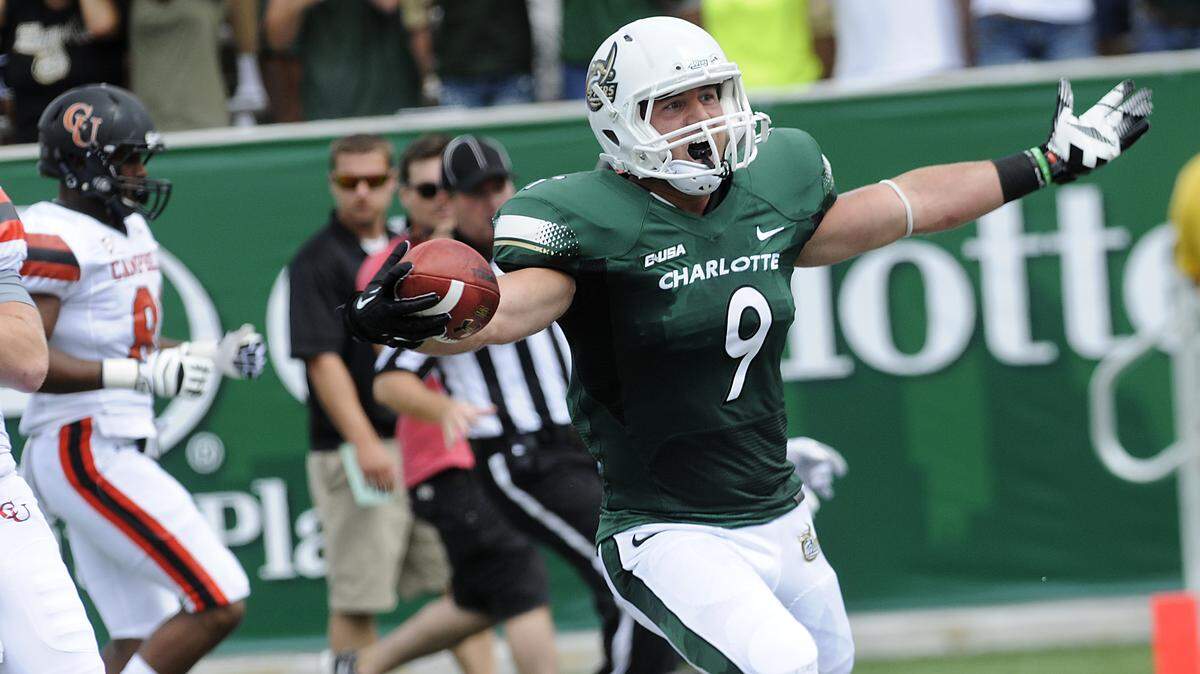 Linebacker Mark Hogan scores the first touchdown in Charlotte 49ers history, a 34-yard interception return against Campbell in 2013.