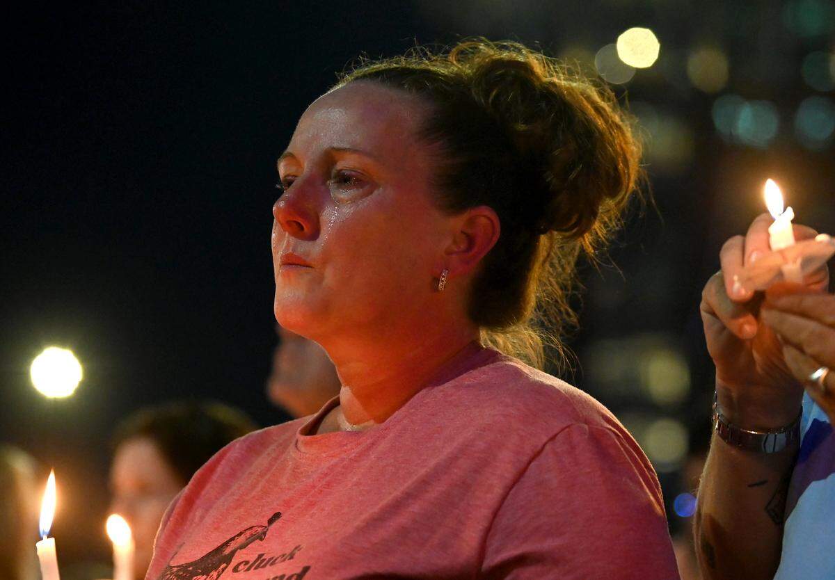 Tears stream down the cheeks of Stephanie Easterling of Charlotte during a memorial service for Iryna Zarutska on Monday.