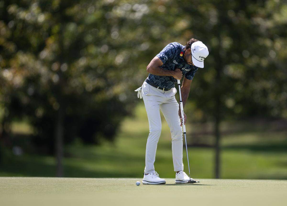 Akshay Bhatia putts on the 12th hole during the second round of the Truist Championship at Quail Hollow Club in Charlotte, N.C., on Friday, May 8, 2026. 