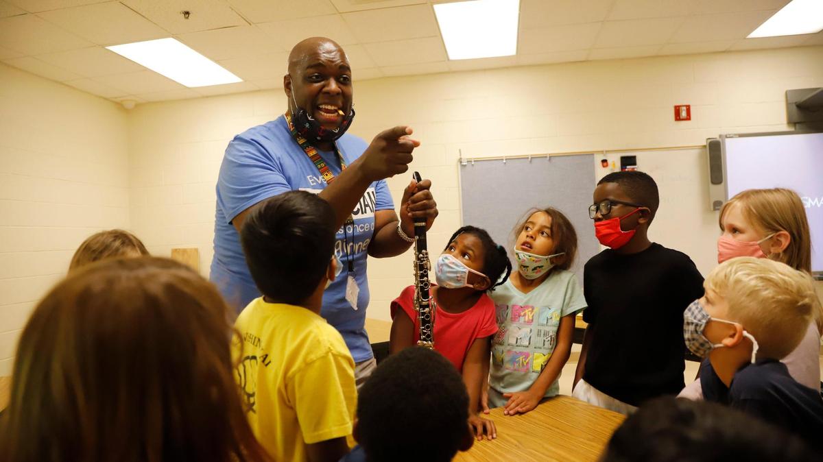 Michael Saunders talks about the clarinet during Camp CMS at Highland Mill Montessori on Wednesday, June 23, 2021 in Charlotte.