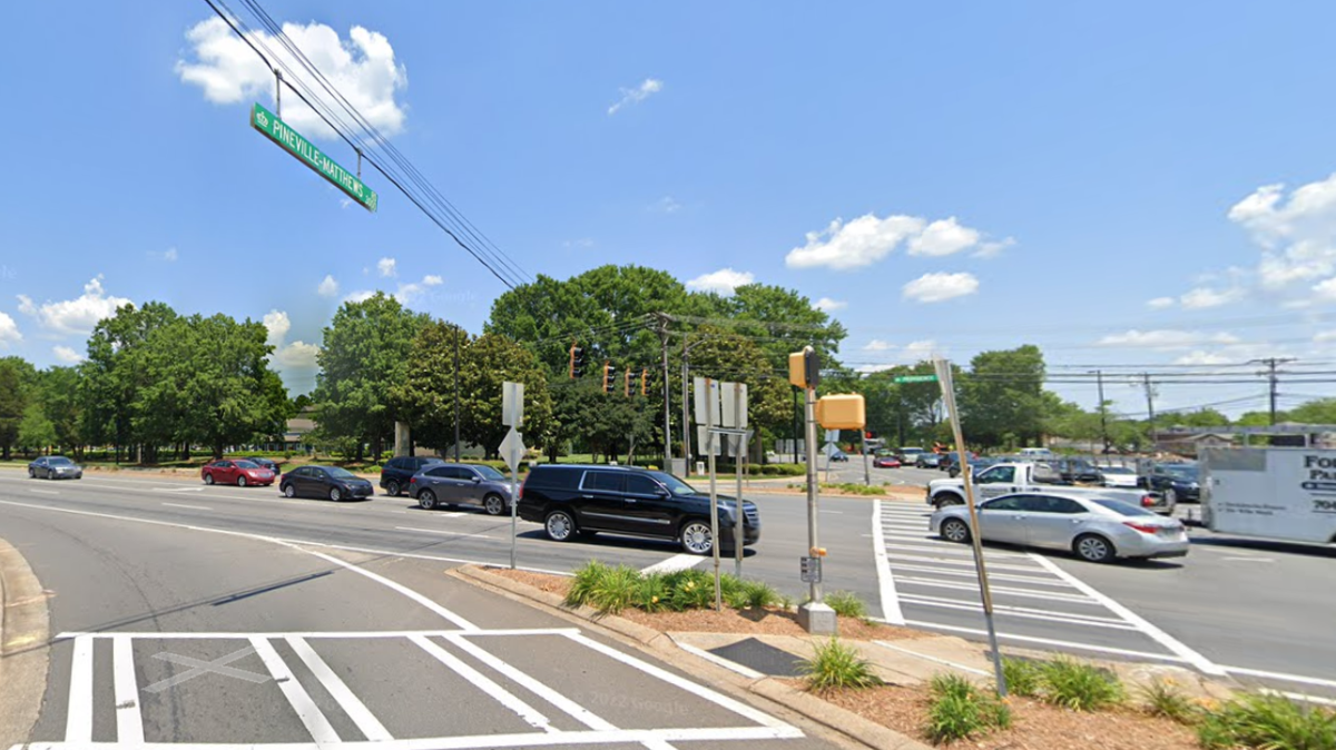 Scott Austin turned himself in on Wednesday, police said, after he struck and killed Eric Macken, 41, who was using a crosswalk in south Charlotte.