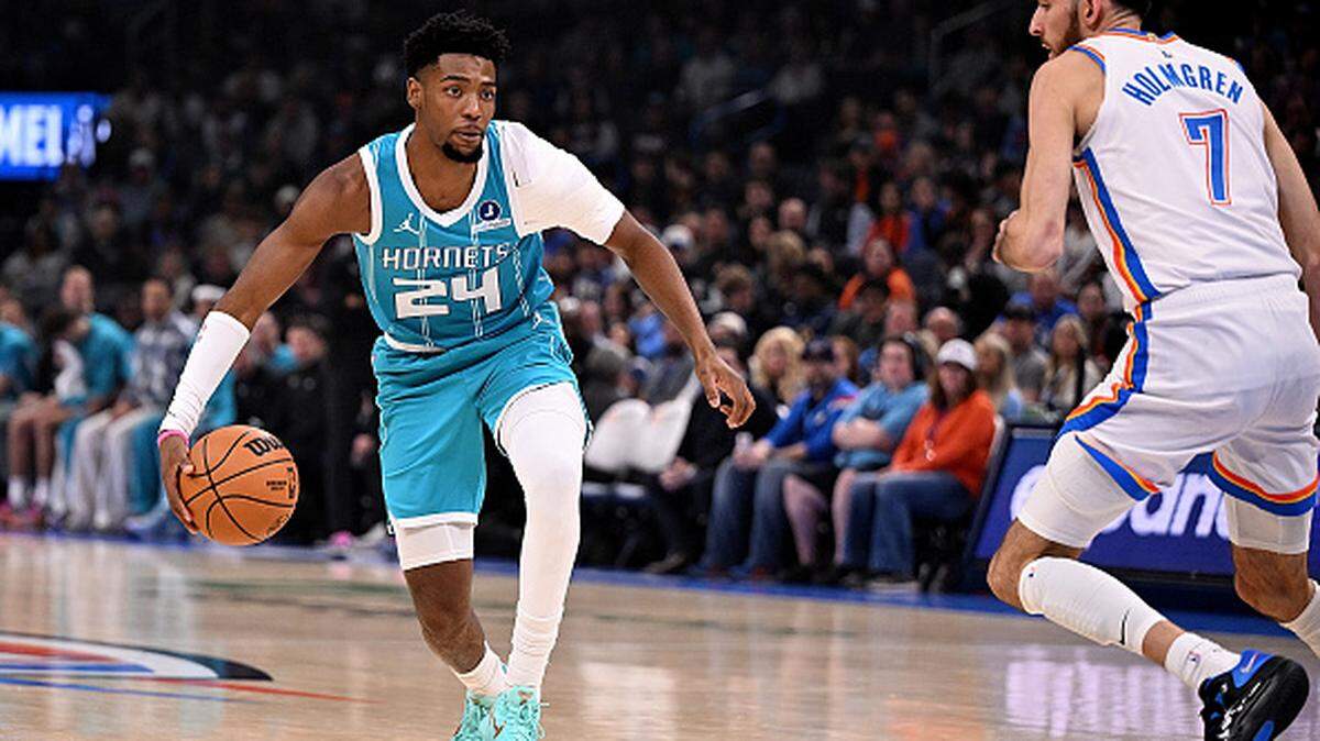 Brandon Miller of the Charlotte Hornets handles the ball during the first half against the Oklahoma City Thunder at Paycom Center.