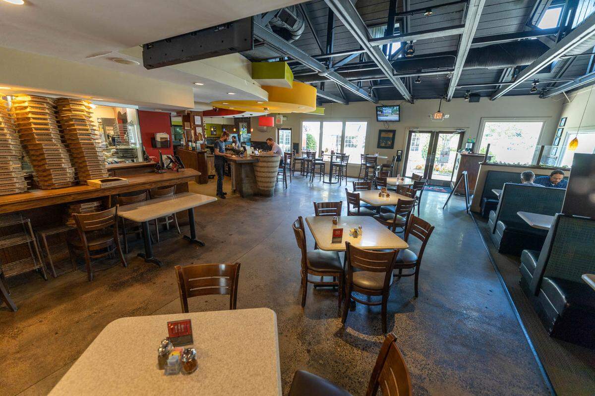 The seating at Brixx Wood Fired Pizza + Craft Bar’s Foxcroft location, 7814 Fairview Road.