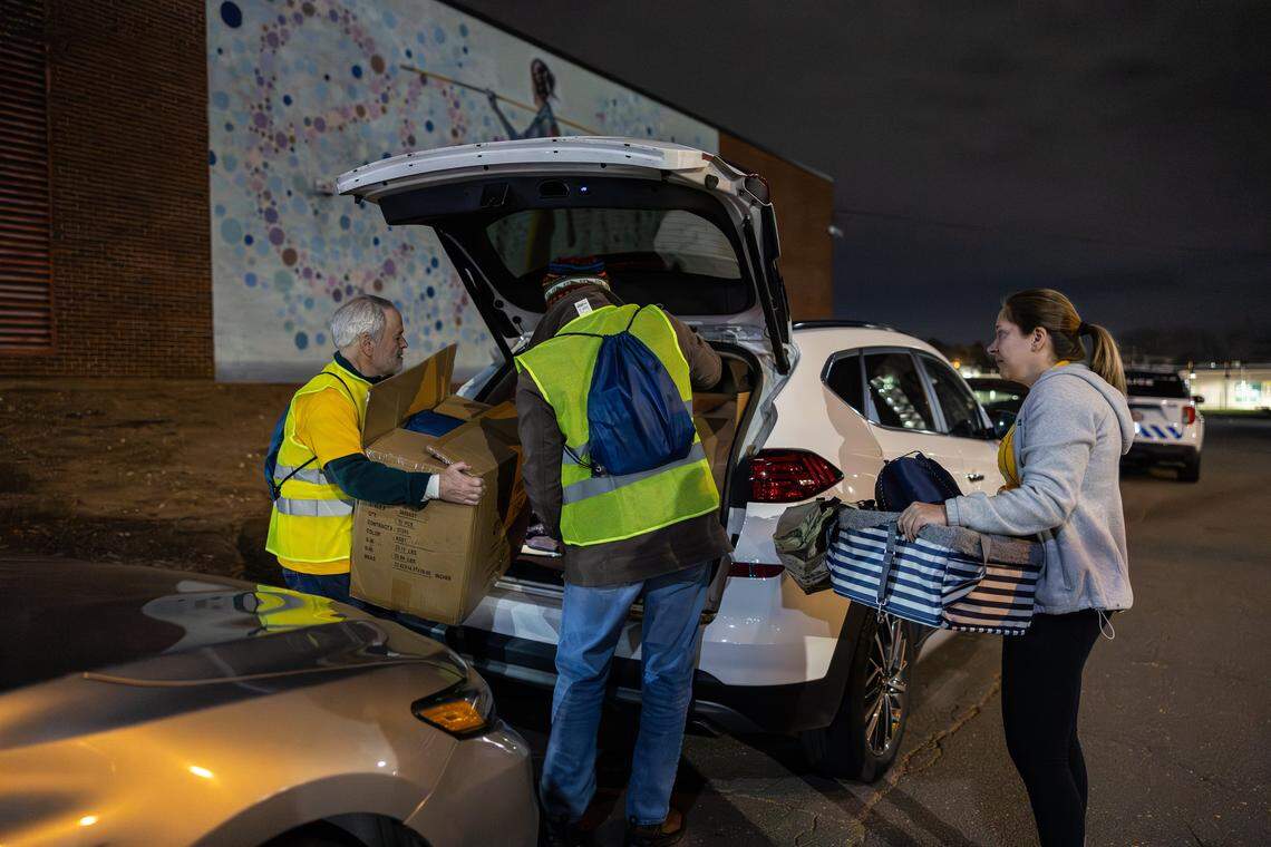 A group loads their car with supplies during the 2026 Point-in-Time Count in Charlotte, N.C., on Thursday, January 22, 2026.