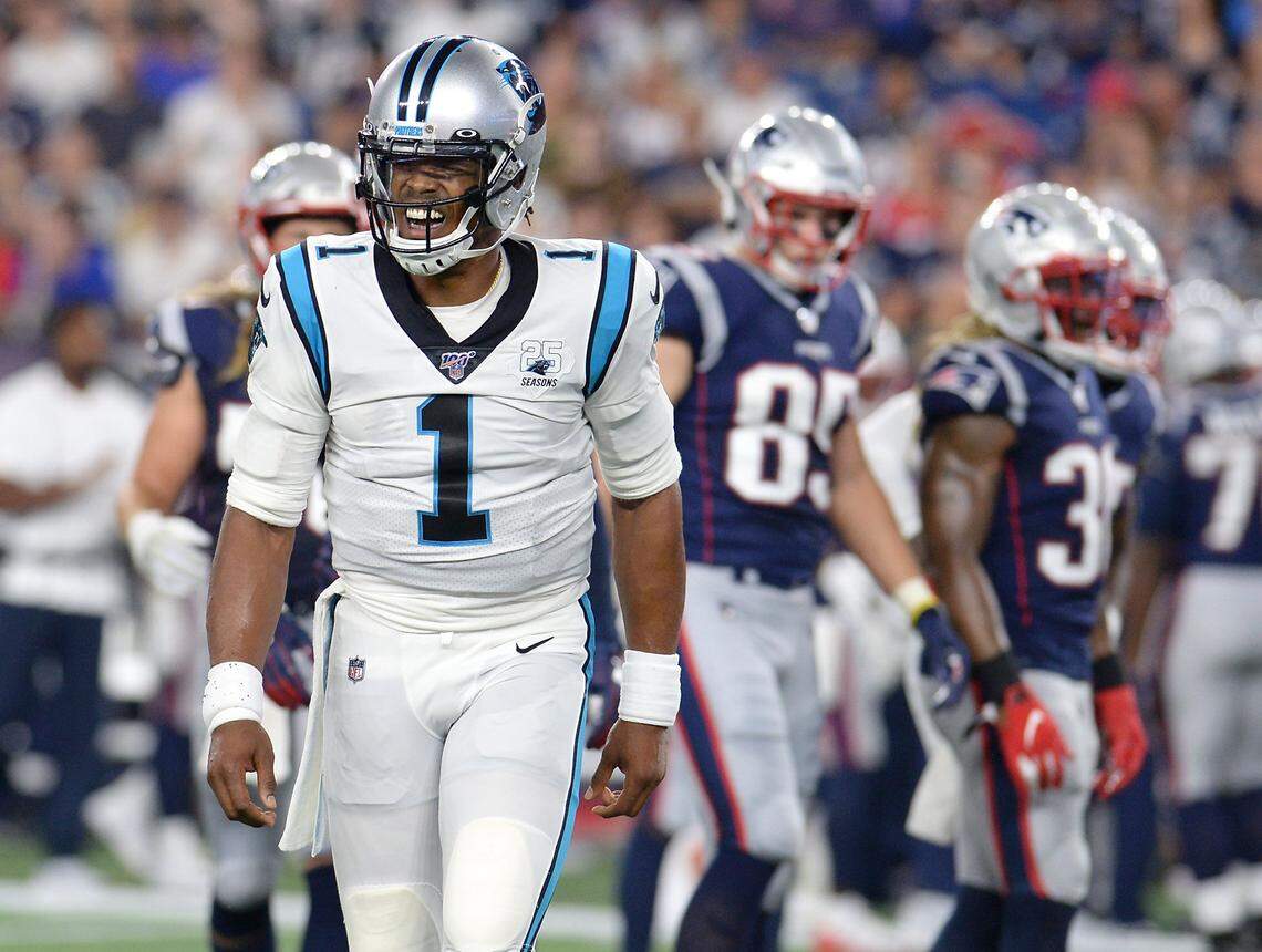 Carolina Panthers quarterback Cam Newton grimaces as he gingerly walks off the field after being sacked for the second time by New England. It was Newton’s first live action in eight months. He left the game after the play due to a left foot injury.