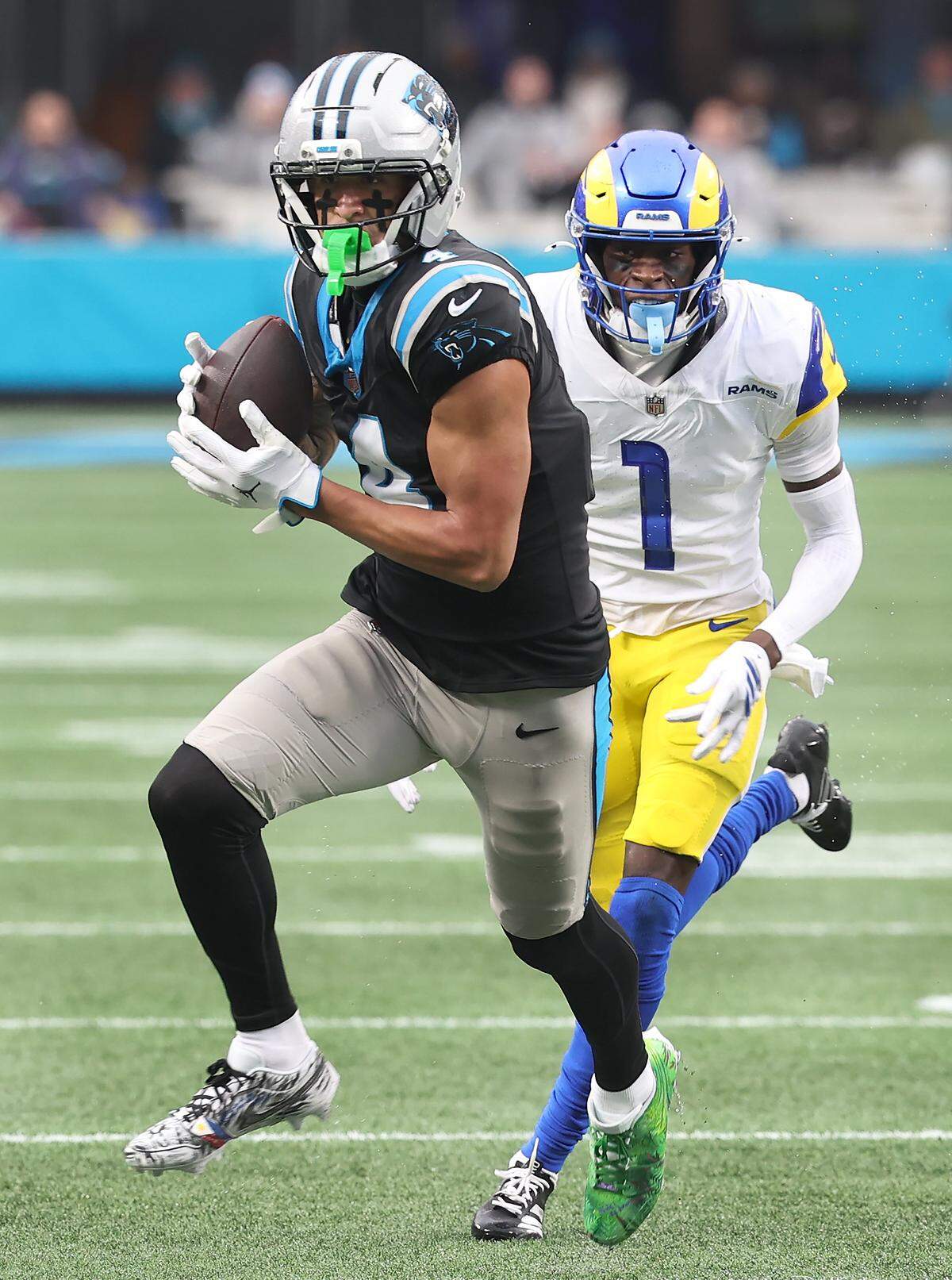 Carolina Panthers wide receiver Tetairoa McMillan secures a touchdown pass from quarterback Bryce Young during fourth quarter action against the Los Angeles Rams at Bank of America Stadium in Charlotte, NC on Sunday, November 30, 2025. The Panthers defeated the Rams 31-28.