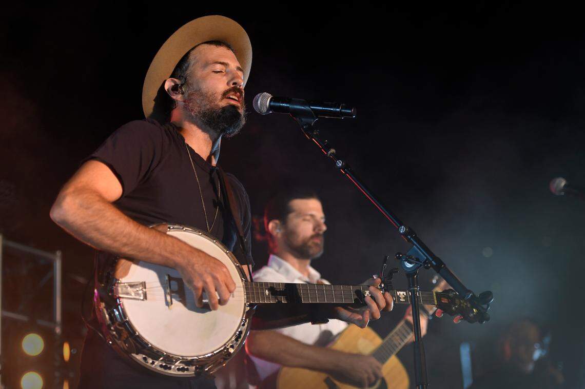 From left, Scott Avett and his brother Seth, seen here at a 2021 concert in Baltimore. The Avett Brothers remain actively involved in the evolution of “Swept Away” as it prepares to make its East Coast debut in November at Arena Stage in Washington, D.C.