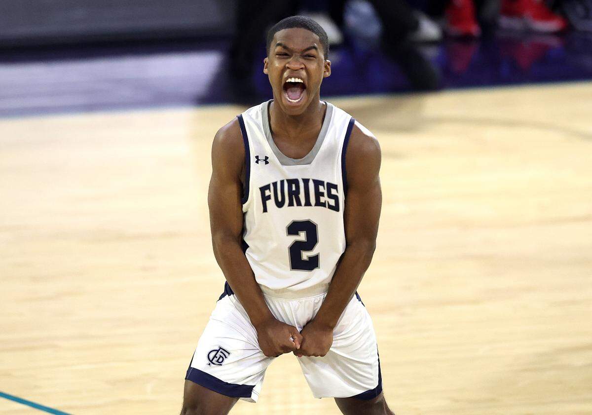 Forsyth Country Day Furies’ JR Adams celebrates the team’s play during action against the Providence Day Chargers in the NCISAA boys state championship game on Saturday, February 28, 2026 at Novant Fieldhouse in Greensboro, NC. Forsyth Country Day defeated Providence Day 69-59.