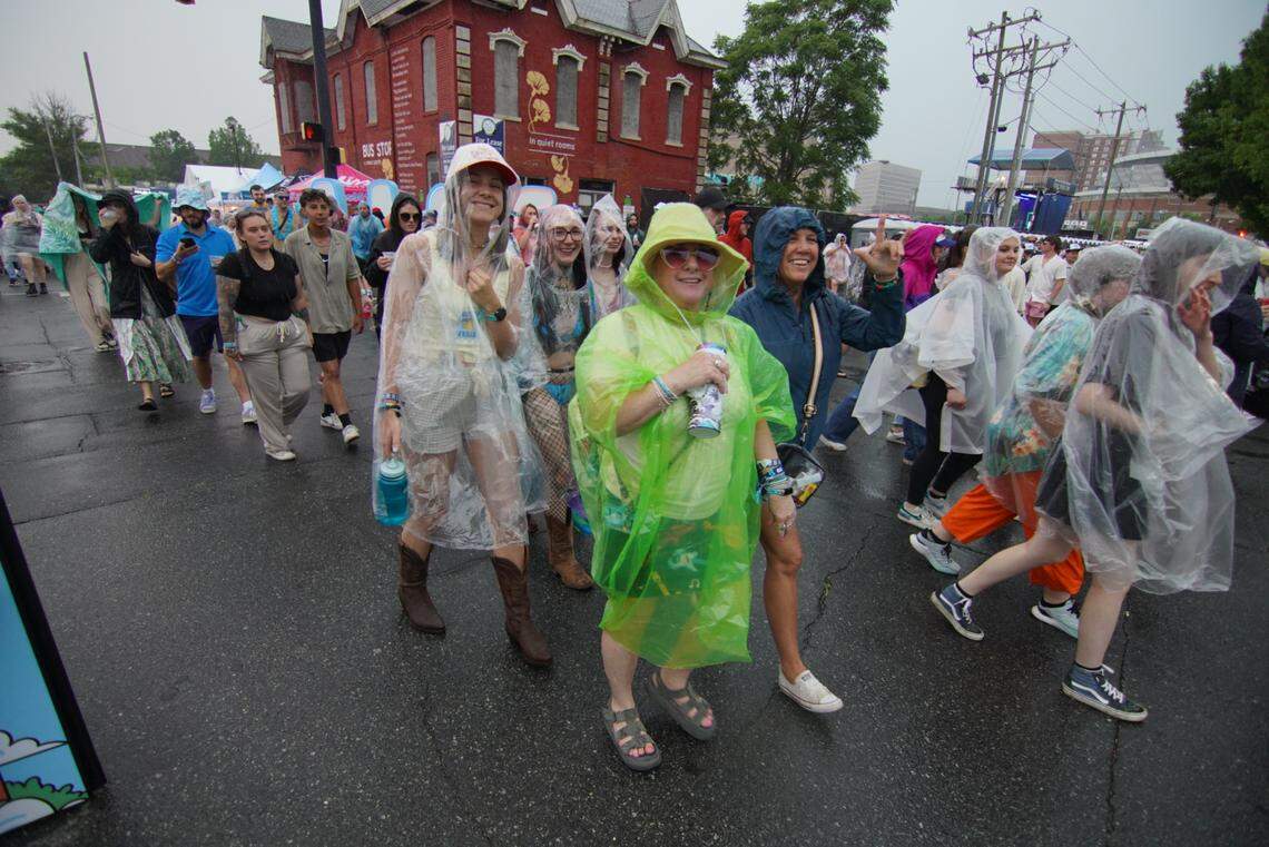 Lovin’ Life Music Fest fans leave the festival grounds after lighting was reported on Saturday, May 3.