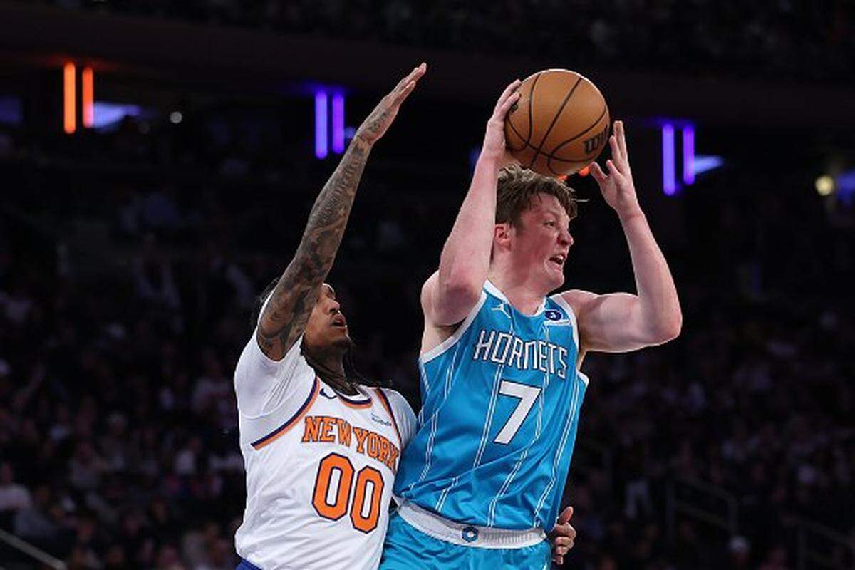 Kon Knueppel #7 of the Charlotte Hornets looks to pass as Jordan Clarkson #00 of the New York Knicks defends during the first half at Madison Square Garden on October 17, 2025 in New York City.
