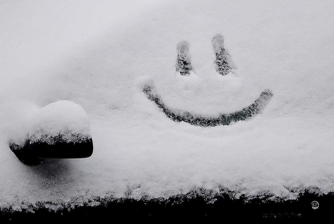 A child’s joy is reflected in the year’s first snowfall and day off from school Tuesday in January 2009 on a snow covered window.