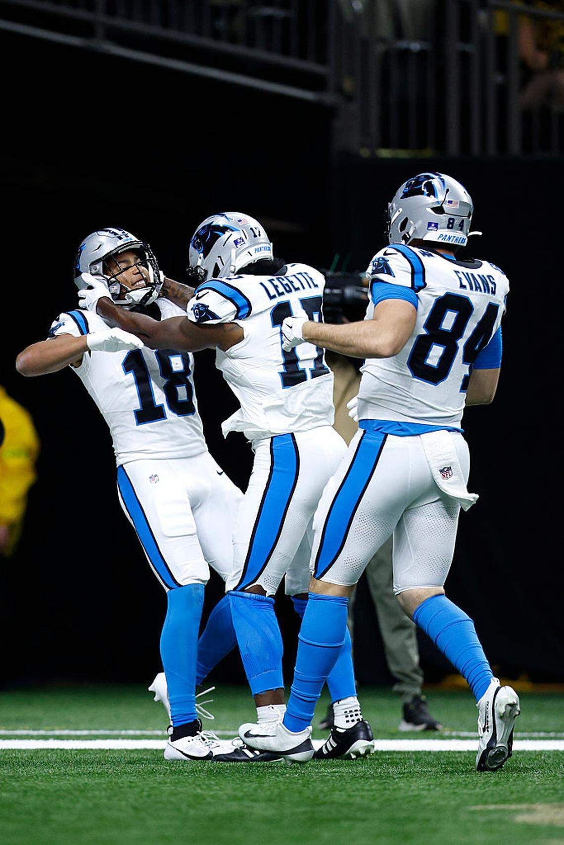 Jalen Coker, #18 of the Carolina Panthers, celebrates after scoring a touchdown with teammate Xavier Legette #17 during the third quarter against the New Orleans Saints at Caesars Superdome on December 14, 2025 in New Orleans, Louisiana.