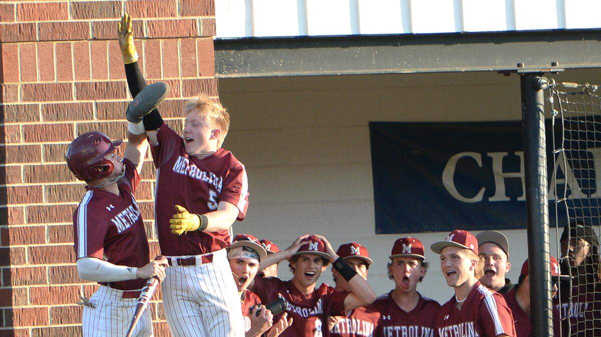 Metrolina Christian leadoff batter #2, Perry Hargett is congratulated after scoring the first run of the game by starting pitcher #5 Chase Kicker in the first inning. Hargett reached via a walk and then stole second and third bases. Metrolina Christian lead Charlotte Christian 3-0 after four innings. The Warriors of Metrolina Christian, sporting a perfect, 19-0 record, travel edto face off against the 14-5, Charlotte Christian Knights. The teams battled on Monday, April 15, 2024.