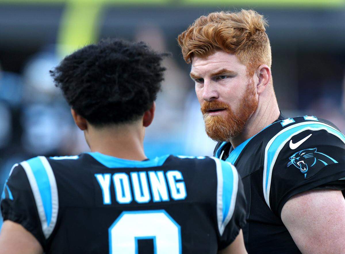 Carolina Panthers quarterbacks Bryce Young, left and Andy Dalton, right, talk along the team’s sideline during second half action against the Dallas Cowboys at Bank of America Stadium in Charlotte, NC on Sunday, November 19, 2023. The Cowboys defeated the Panthers 33-10.