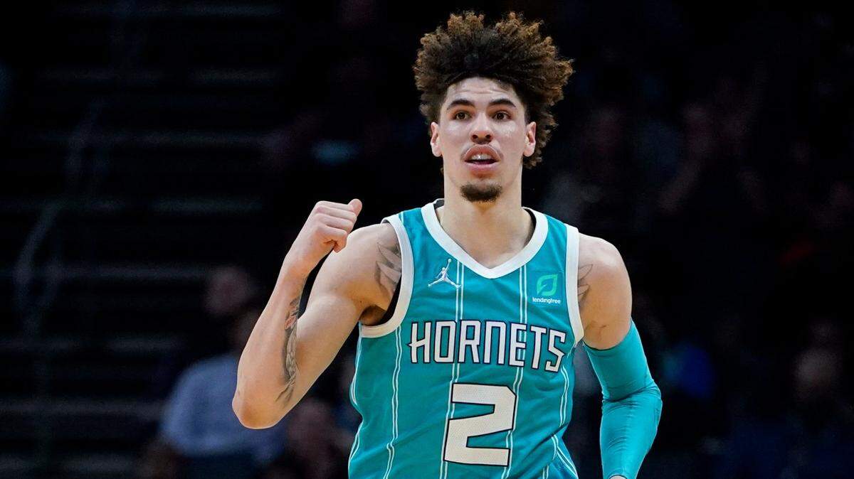 Charlotte Hornets guard LaMelo Ball celebrates during the second half of an NBA basketball game against the San Antonio Spurs on Saturday, March 5, 2022, in Charlotte, N.C. (AP Photo/Chris Carlson)