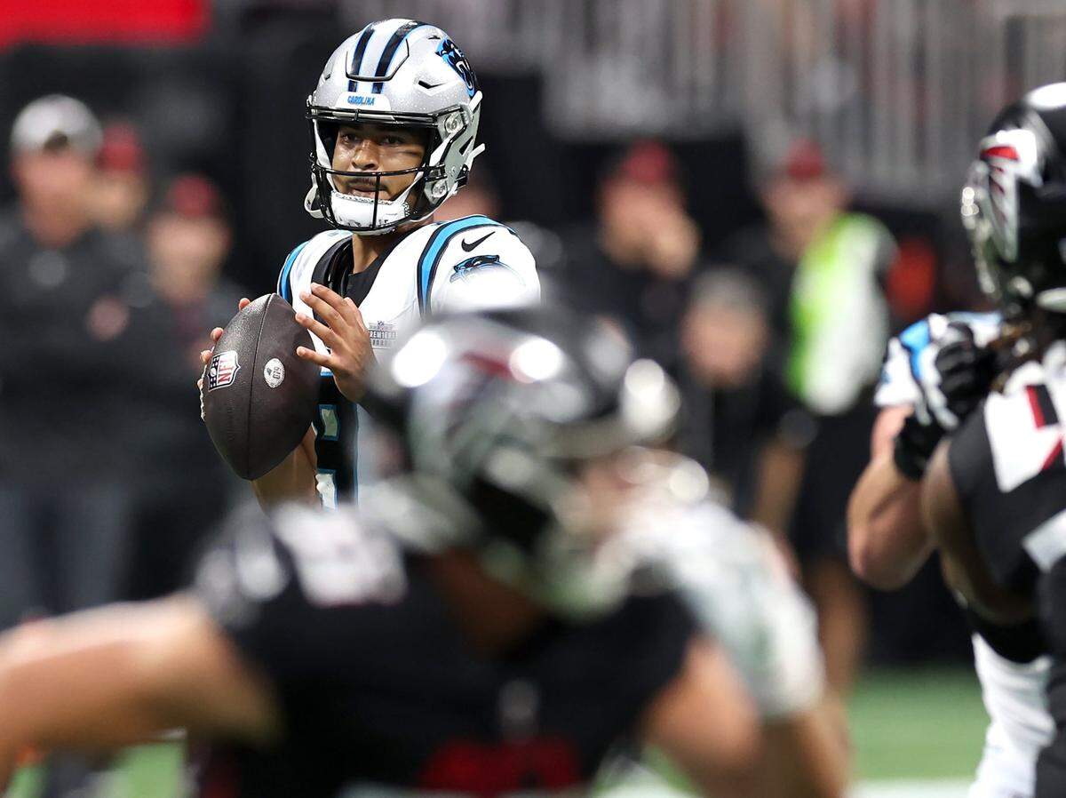 Carolina Panthers quarterback Bryce Young stands in the pocket looking to pass to a receiver during second-quarter action against the Atlanta Falcons at Mercedes-Benz Stadium in Atlanta, GA on Sunday, September 10, 2023. Young threw for 146 yards, with one TD and two interceptions.