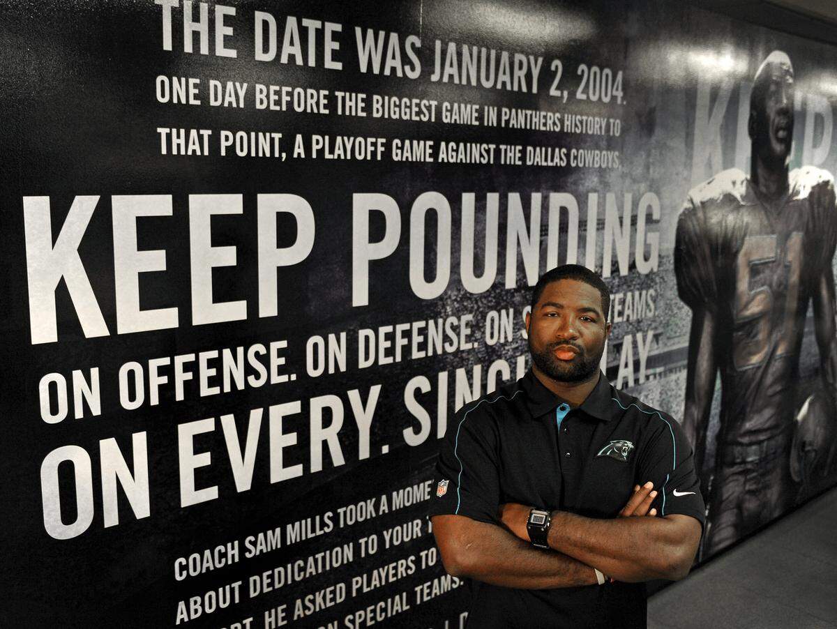 Carolina Panthers assistant coach Sam Mills III stands in front of the mural of his father in the team’s weight room on Friday, October 19, 2012. Jeff Siner - jsiner@charlotteobserver.com