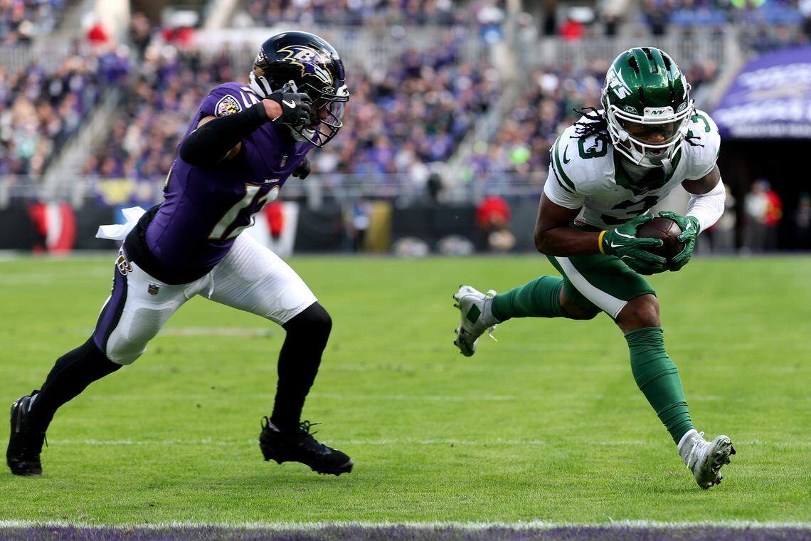 New York Jets wide receiver John Metchie III scores a touchdown against Baltimore Ravens safety Alohi Gilman in a November 2025 game at M&T Bank Stadium.