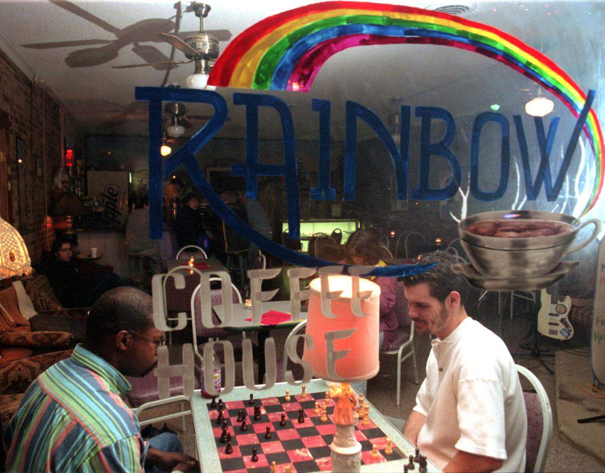 Leroy Renrick, left, and Greg Spence enjoy a game of chess at Rainbow Coffee House in Mount Holly in December 1996.